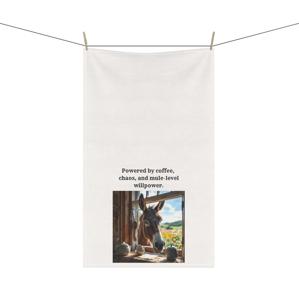 White towel with a donkey photo and text on a clothesline.