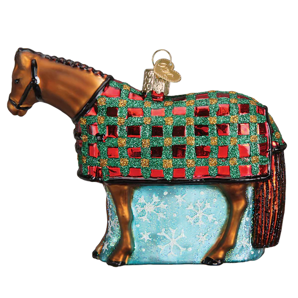 Decorative horse ornament with a checkered blanket and snowflake pattern on a white background