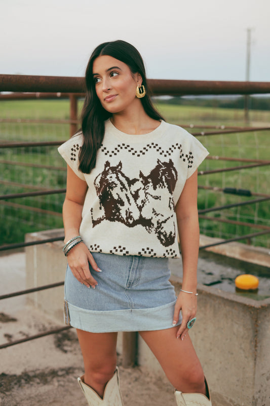 Woman wearing a sweater  with horse design outdoors