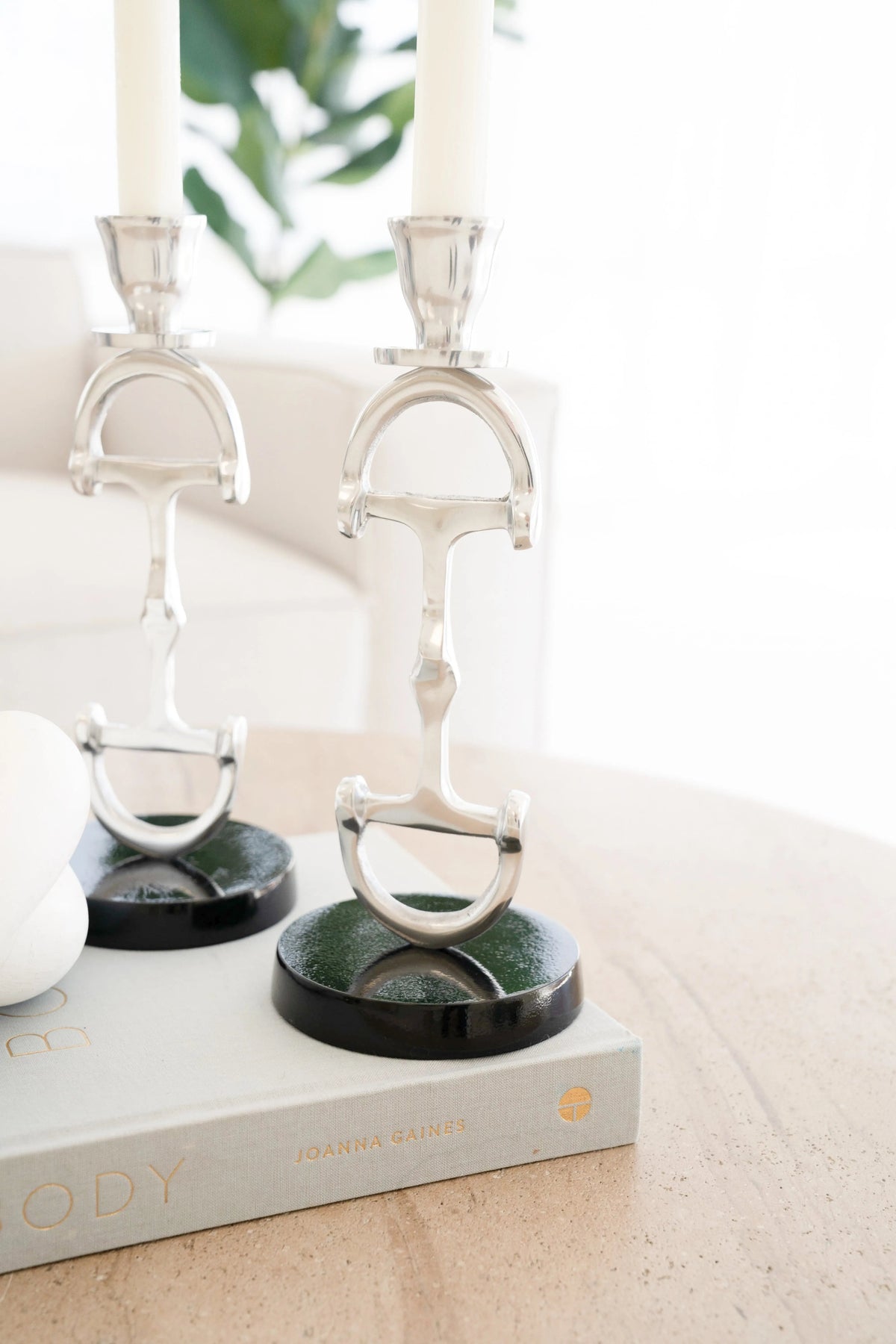 Decorative candle holders on a book with a blurred background