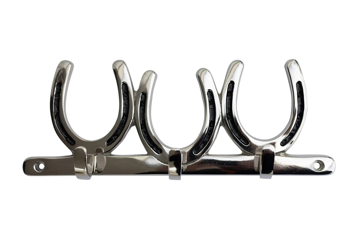 A polished chrome wall-mounted four-horse rack with four curved hook shapes attached to a horizontal bar, shown against a plain white background.