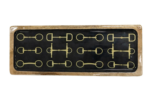 A rectangular decorative tray with a black center panel featuring twelve gold horsebit motifs arranged in two rows, surrounded by a light wood border.
