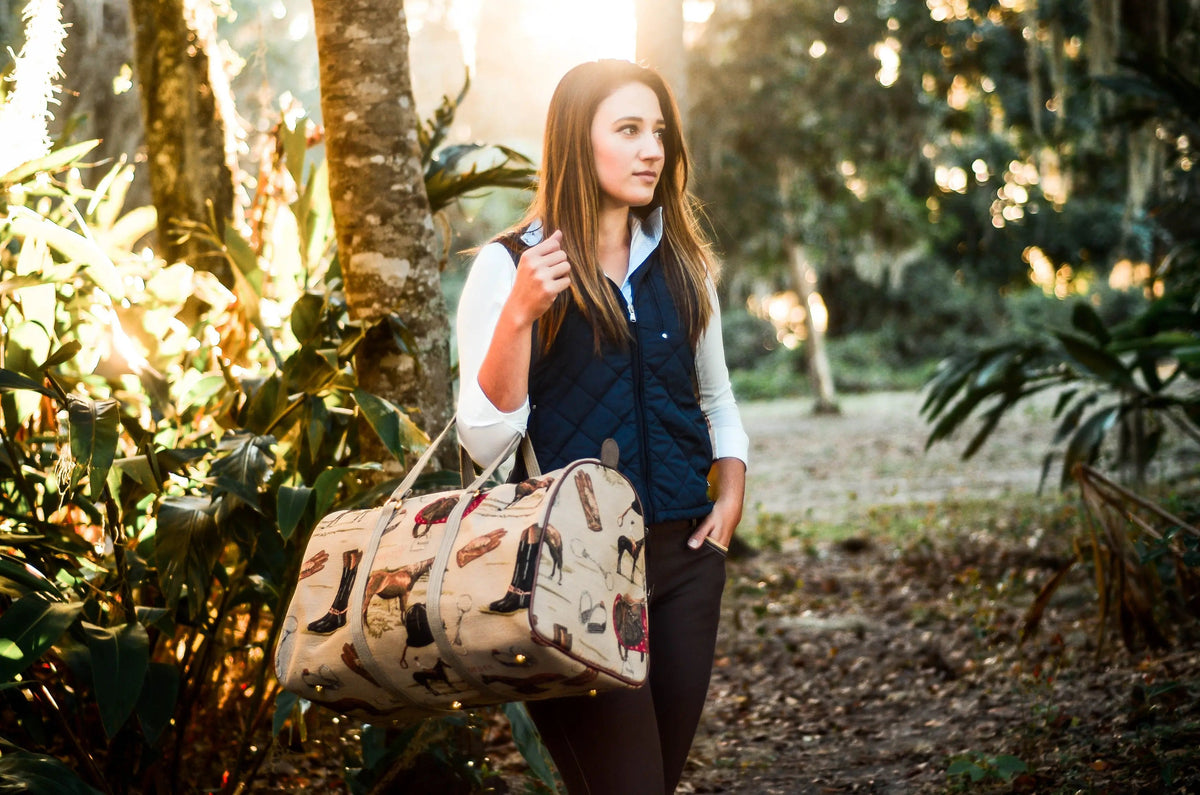 Woman walking through a forest carrying a patterned bag