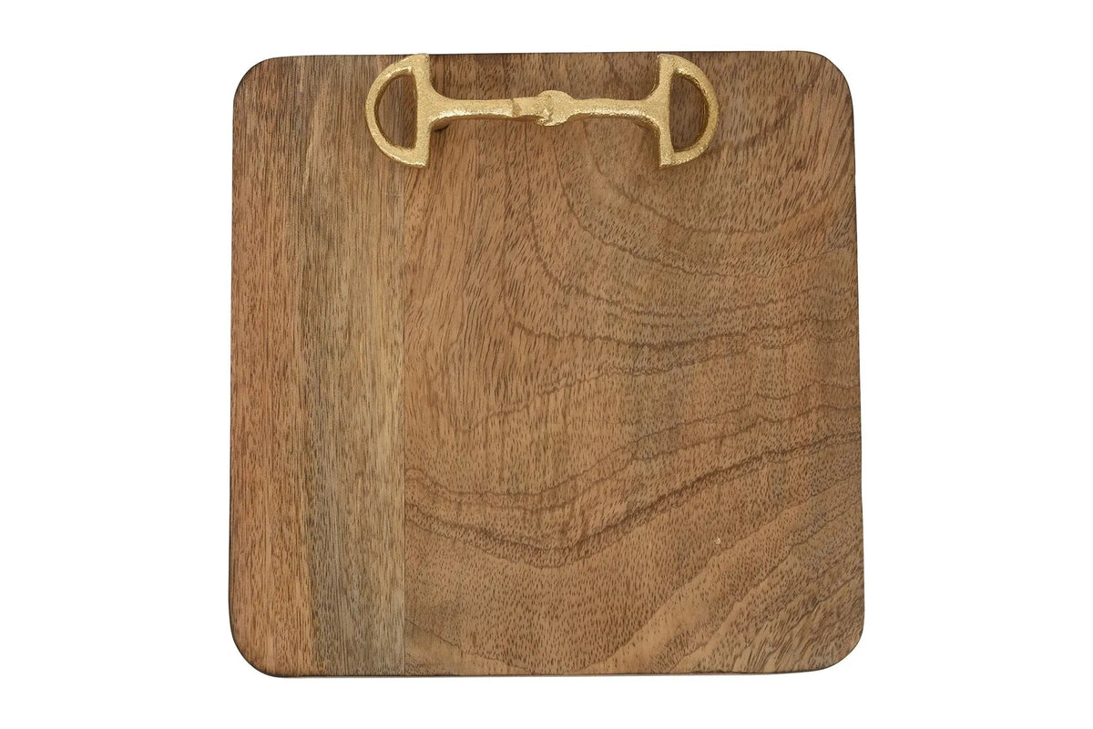 Wooden cutting board with a brass horse bit design on a white background