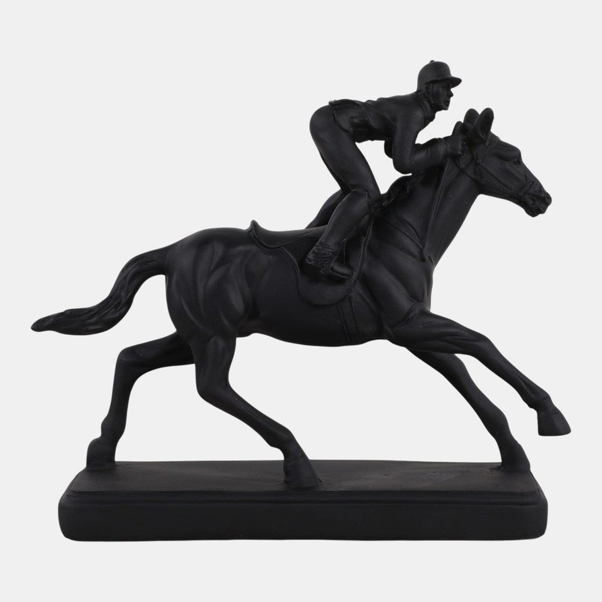 Black sculpture of a person riding a horse on a white background