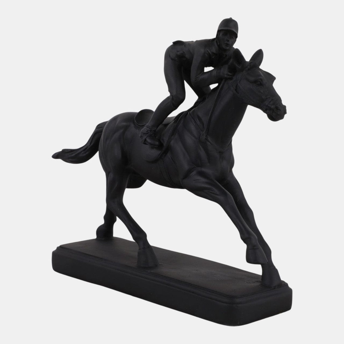 Black statue of a horse and jockey on a white background