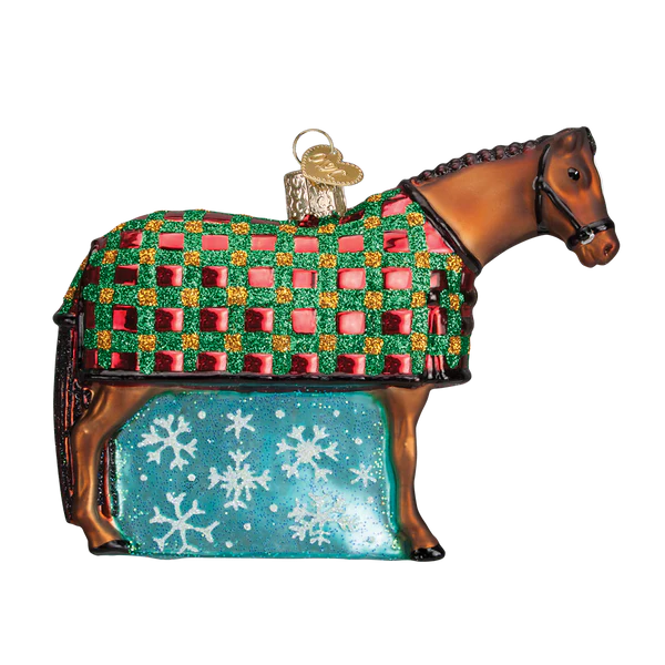Glass horse ornament with a checkered blanket and snowflake pattern on a white background