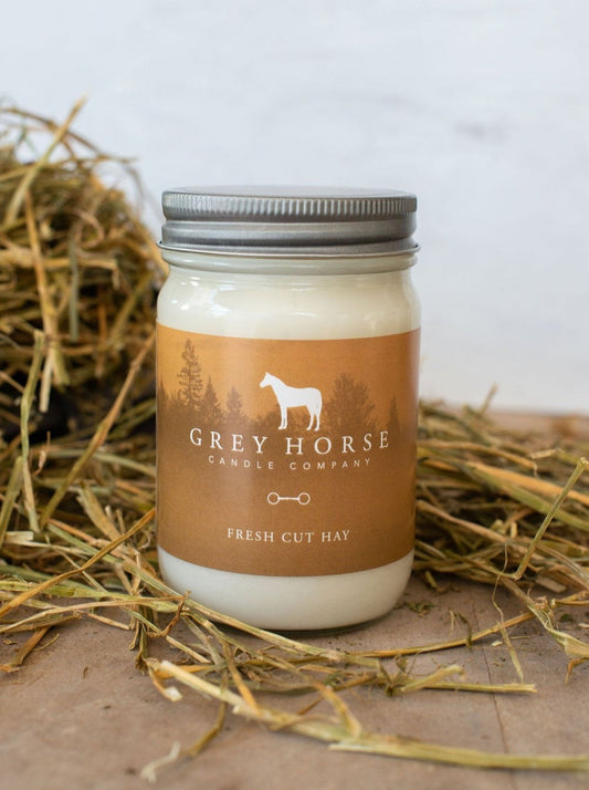 Jar of candle from Grey Horse Candle Company on a hay background