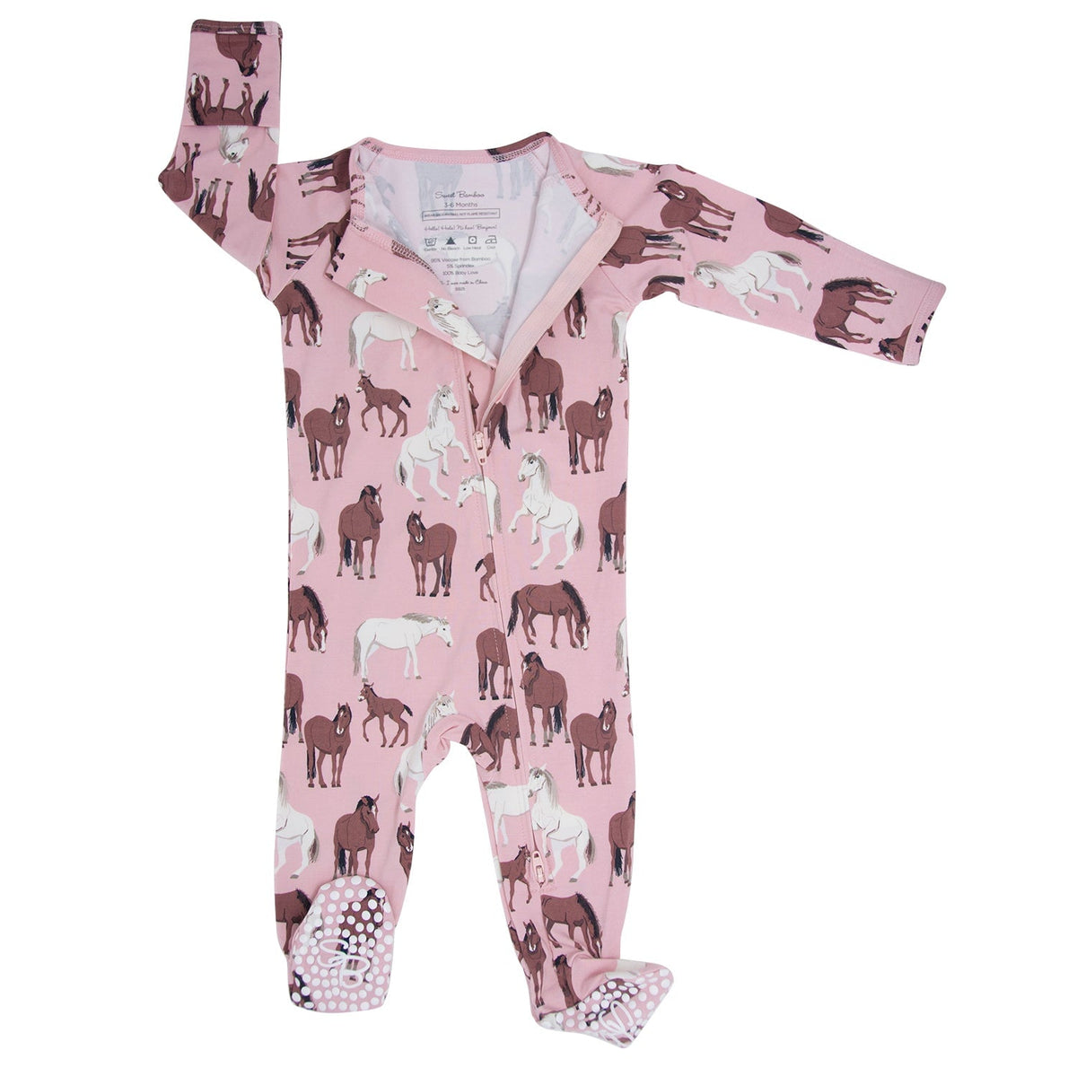 Baby onesie with horse pattern on a pink background