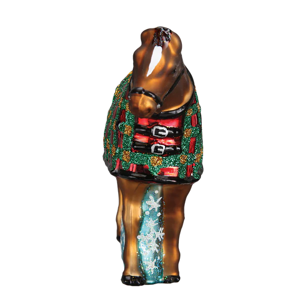 Decorative horse figurine wearing a colorful sweater on a white background